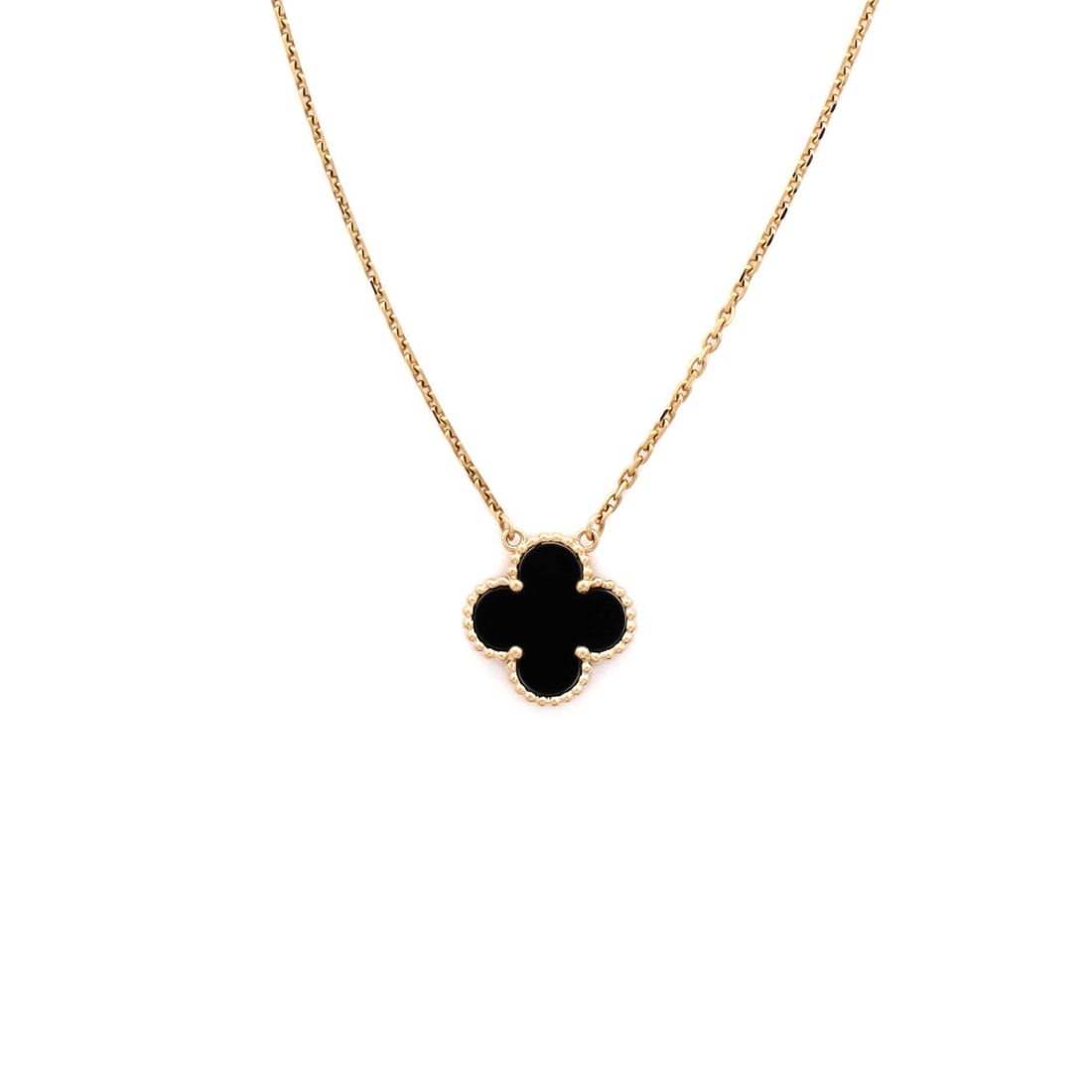 Van Cleef & Arpels Vintage Alhambra Pendant Necklace 18K Yellow Gold and Onyx: Polished cleanly, the Van Cleef & Arpels Vintage Alhambra Pendant Necklace positions its centerpiece exactly where the eye lands first. Worked in 18K Yellow Gold and Onyx. The drop sits exactly at the