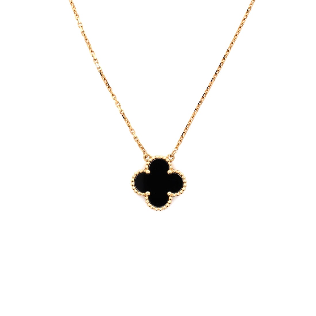 Van Cleef & Arpels Vintage Alhambra Pendant Necklace 18K Yellow Gold and Onyx: Built for the collarbone, the Van Cleef & Arpels Vintage Alhambra Pendant Necklace sits with elegant intent against the collarbone. Worked in 18K Yellow Gold and Onyx. The drop sits exactly at the spo
