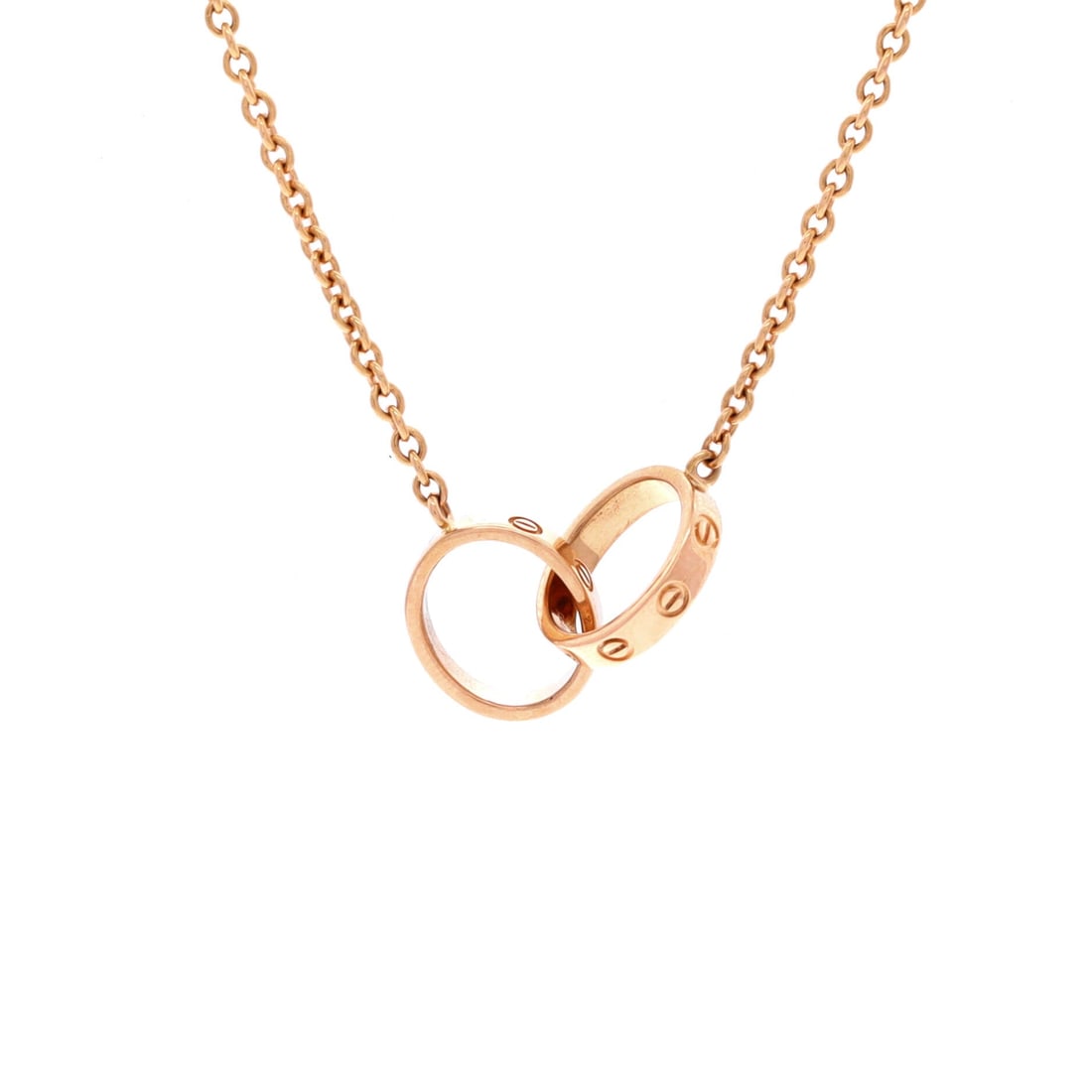 Cartier Love Interlocking Necklace 18K Rose Gold: Architecturally restrained, the Cartier Love Interlocking Necklace balances proportion with a piece-of-jewelry confidence. Worked in 18K Rose Gold. Its proportions slip cleanly under a collar yet read