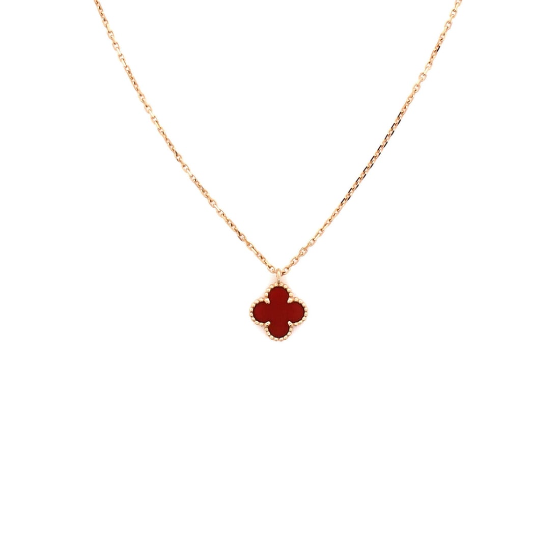 Van Cleef & Arpels Sweet Alhambra Pendant Necklace 18K Rose Gold and Carnelian: Architecturally restrained, the Van Cleef & Arpels Sweet Alhambra Pendant Necklace translates a house signature into a wearable line. Worked in 18K Rose Gold and Carnelian. The chain length reads as c