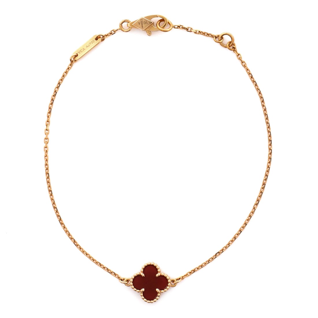 Van Cleef & Arpels Sweet Alhambra Bracelet 18K Rose Gold and Carnelian: Wrought in rose gold, the Van Cleef & Arpels Sweet Alhambra Bracelet pairs a controlled silhouette with the supple movement of a well-built bangle. Worked in 18K Rose Gold and Carnelian. The articulat
