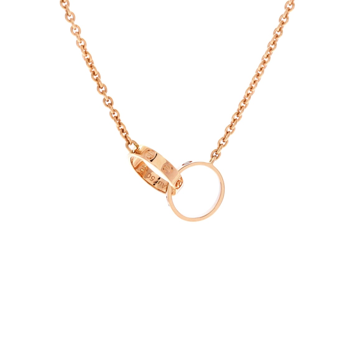 Cartier Love Interlocking Necklace 18K Rose Gold: Set in rose gold, the Cartier Love Interlocking Necklace pulls focus to the collarbone with composed restraint. Worked in 18K Rose Gold. Its proportions slip cleanly under a collar yet read distinctly