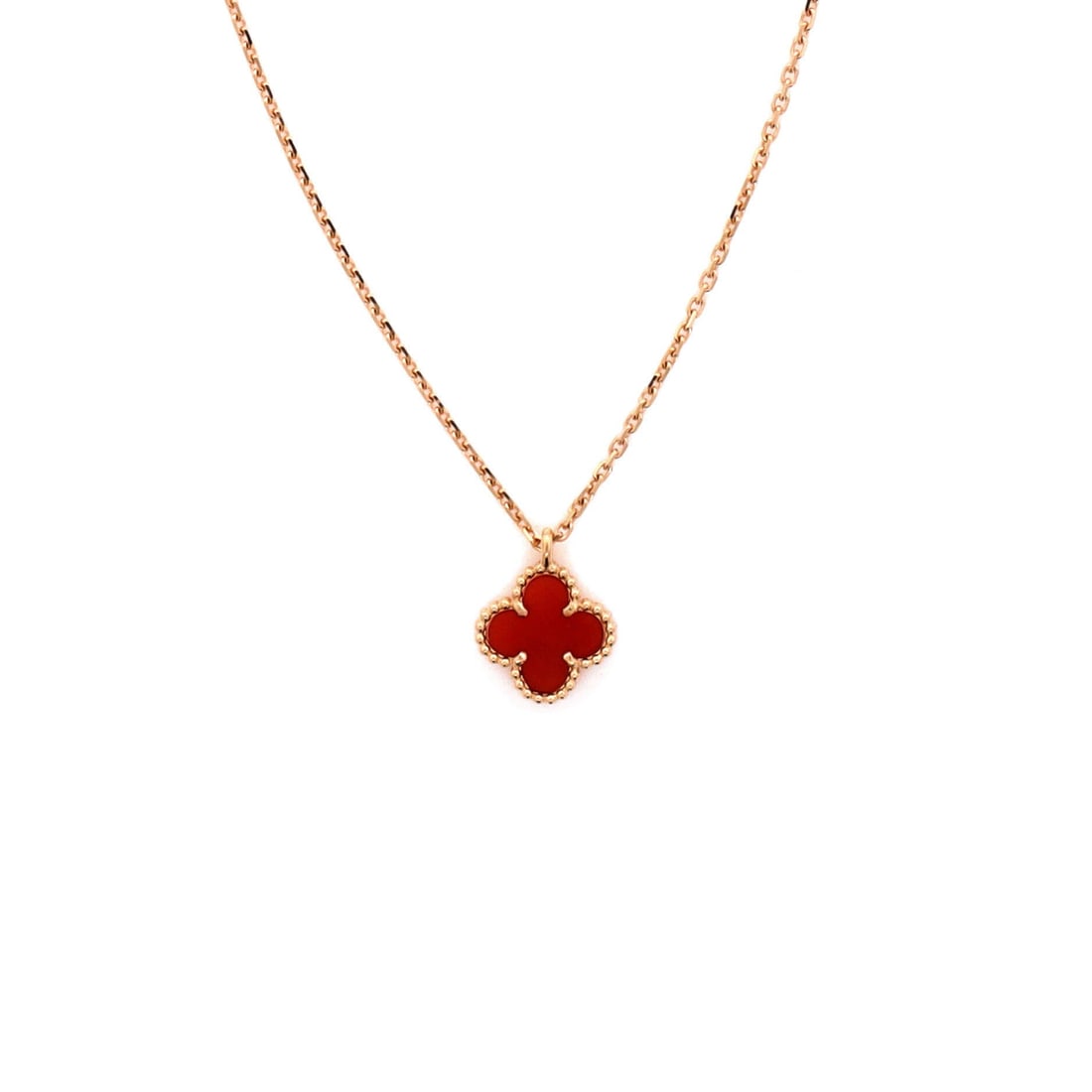 Van Cleef & Arpels Sweet Alhambra Pendant Necklace 18K Rose Gold and Carnelian: Rendered in rose gold, the Van Cleef & Arpels Sweet Alhambra Pendant Necklace layers chain and ornament with deliberate restraint. Worked in 18K Rose Gold and Carnelian. Scale-wise it lives in the swe
