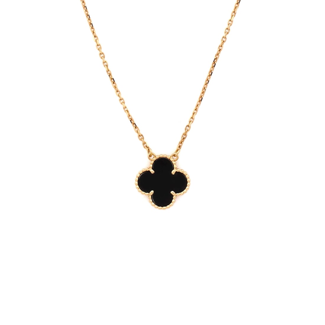 Van Cleef & Arpels Vintage Alhambra Pendant Necklace 18K Yellow Gold and Onyx: Worked in yellow gold, the Van Cleef & Arpels Vintage Alhambra Pendant Necklace positions its centerpiece exactly where the eye lands first. Worked in 18K Yellow Gold and Onyx. The drop sits exactly a