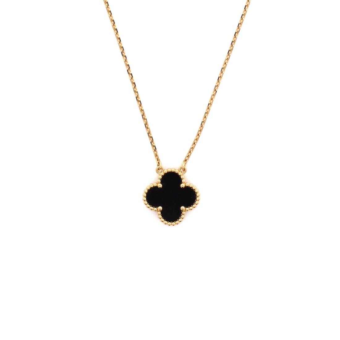 Van Cleef & Arpels Vintage Alhambra Pendant Necklace 18K Yellow Gold and Onyx: Drawn in yellow gold, the Van Cleef & Arpels Vintage Alhambra Pendant Necklace reads as both ornament and quiet emblem. Worked in 18K Yellow Gold and Onyx. Its proportions slip cleanly under a collar 