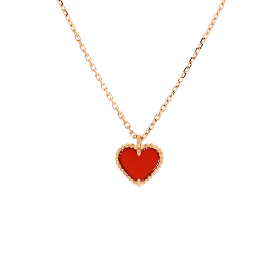 Van Cleef & Arpels Sweet Alhambra Heart Pendant Necklace 18K Rose Gold and Carnelian: Linked with care, the Van Cleef & Arpels Sweet Alhambra Heart Pendant Necklace positions its centerpiece exactly where the eye lands first. Worked in 18K Rose Gold and Carnelian. The chain length read