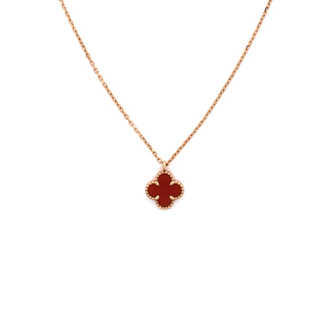 Van Cleef & Arpels Sweet Alhambra Pendant Necklace 18K Rose Gold and Carnelian: Rendered in rose gold, the Van Cleef & Arpels Sweet Alhambra Pendant Necklace reads as both ornament and quiet emblem. Worked in 18K Rose Gold and Carnelian. The drop sits exactly at the spot a though