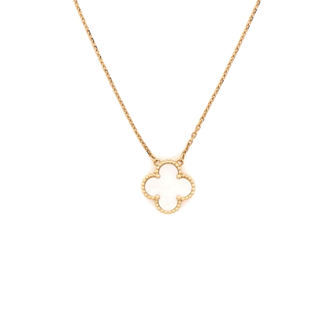 Van Cleef & Arpels Vintage Alhambra Pendant Necklace 18K Yellow Gold and Mother of Pearl: Worked in yellow gold, the Van Cleef & Arpels Vintage Alhambra Pendant Necklace pulls focus to the collarbone with composed restraint. Worked in 18K Yellow Gold and Mother of Pearl. Scale-wise it live