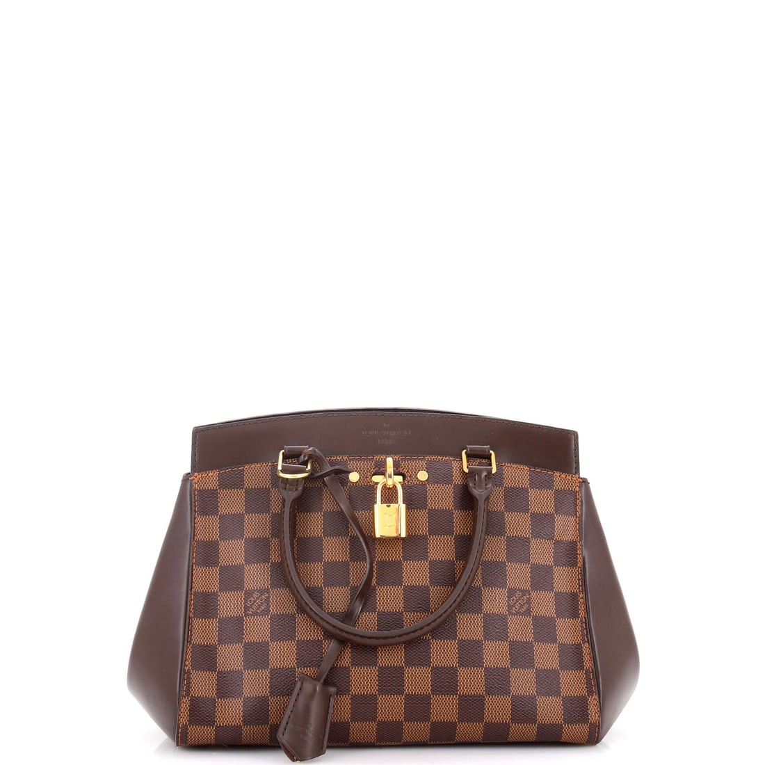 Louis Vuitton Rivoli Handbag Damier BB: Louis Vuitton's Rivoli Handbag arrives in its working size, the cut that handles the day without flexing the silhouette. A clean, editorial brown pulls the eye first, cut from Damier, Vuitton's