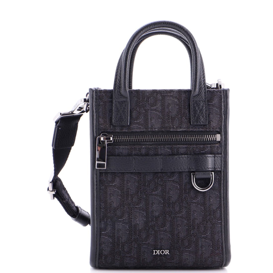 Christian Dior Safari North South Convertible Tote Oblique Canvas Mini: Safari North South Convertible Tote by Christian Dior is built around its interior logic, the compartments calibrated for daily rotation rather than catalog elegance. A clean, editorial black pulls th