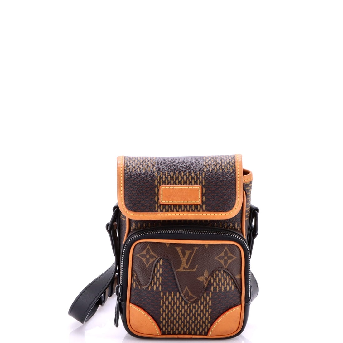Louis Vuitton Nigo Amazone Messenger Bag Limited Edition Giant Damier and Monogram Canvas Nano: Nigo Amazone Messenger Bag by Louis Vuitton is built around its interior logic, the compartments calibrated for daily rotation rather than catalog elegance. A clean, editorial brown pulls the eye firs