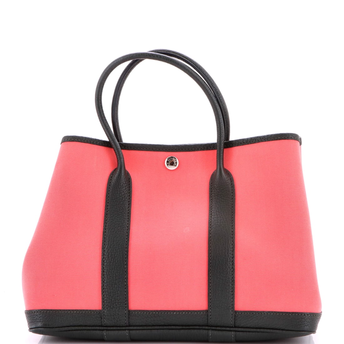 Louis Vuitton Tuileries Handbag Monogram Canvas with Leather: Louis Vuitton's Tuileries Handbag reads deliberate from every angle, the silhouette in monogram canvas with leather sketched with the architectural restraint the house is known for. In brown, red, the