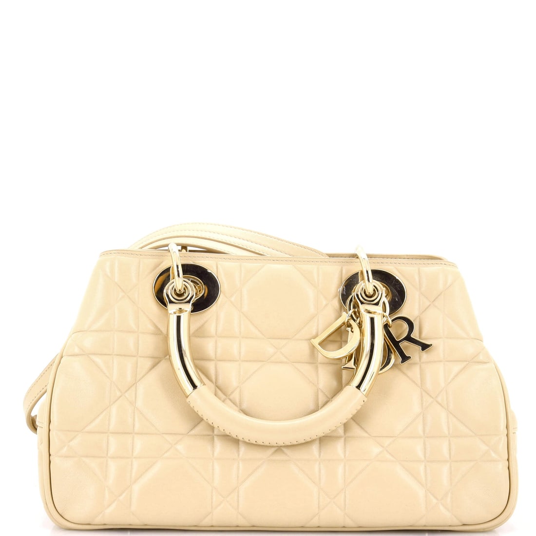 Louis Vuitton Keepall Bandouliere Bag Monogram Canvas 45: The Louis Vuitton Keepall Bandouliere Bag's slip and zip pockets read like a brief from the editor's desk, organized for the realities of a working day. The brown treatment carries its own presence, d