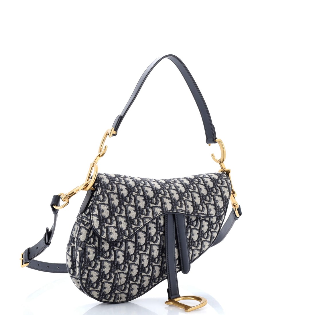 Christian Dior Saddle Crossbody Bag Leather Mini: The Leather on this Christian Dior Saddle Crossbody Bag behaves the way only a house hide can, settling against the frame with the right amount of give. The black treatment carries its own presence, c