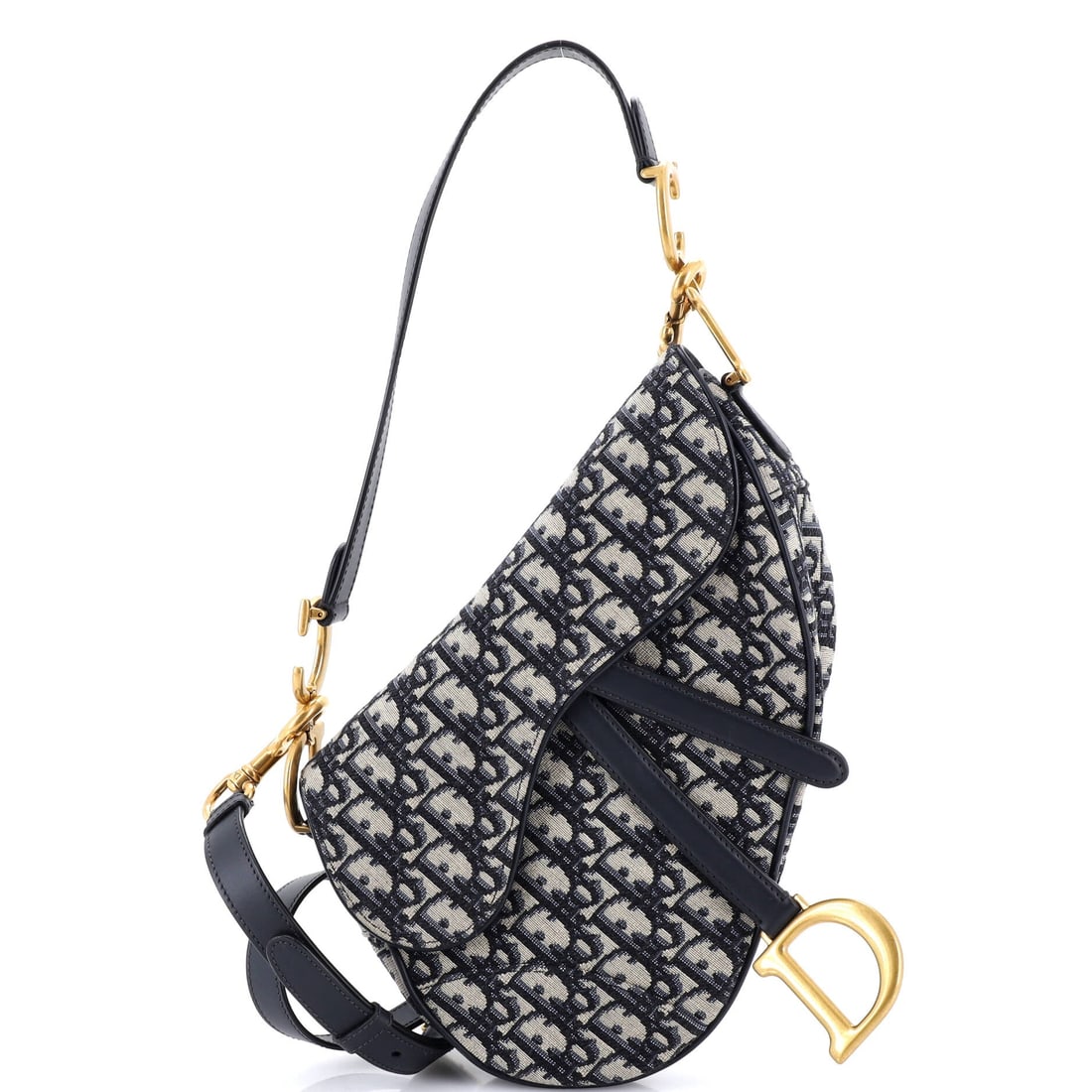 Christian Dior KAWS Saddle Crossbody Bag Leather with Applique: Every pocket on the Christian Dior KAWS Saddle Crossbody Bag earns its place, the interior laid out for keys, cards, phone and the small accessories of a day. The black treatment carries its own prese