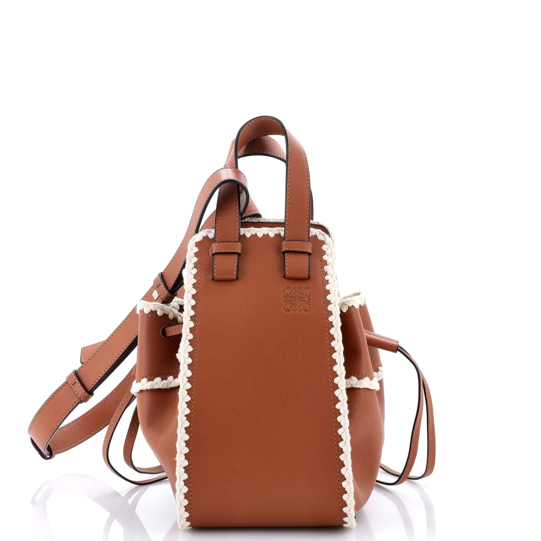 Loewe Hammock Bag Leather with Crochet Detail Small: Lift the flap on this Loewe Hammock Bag and it resolves into clear compartments, built for real carry rather than catalog photography. Cast in a saturated brown, the kind of palette that earns a secon