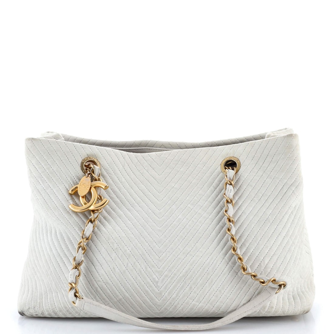 Chanel Medallion Charm Tote Chevron Wrinkled Lambskin Large: Chanel's Medallion Charm Tote earns its keep inside, the layout reading higher in pocket count than the silhouette suggests. A clean, editorial neutral pulls the eye first, drawn in lambskin, the soft