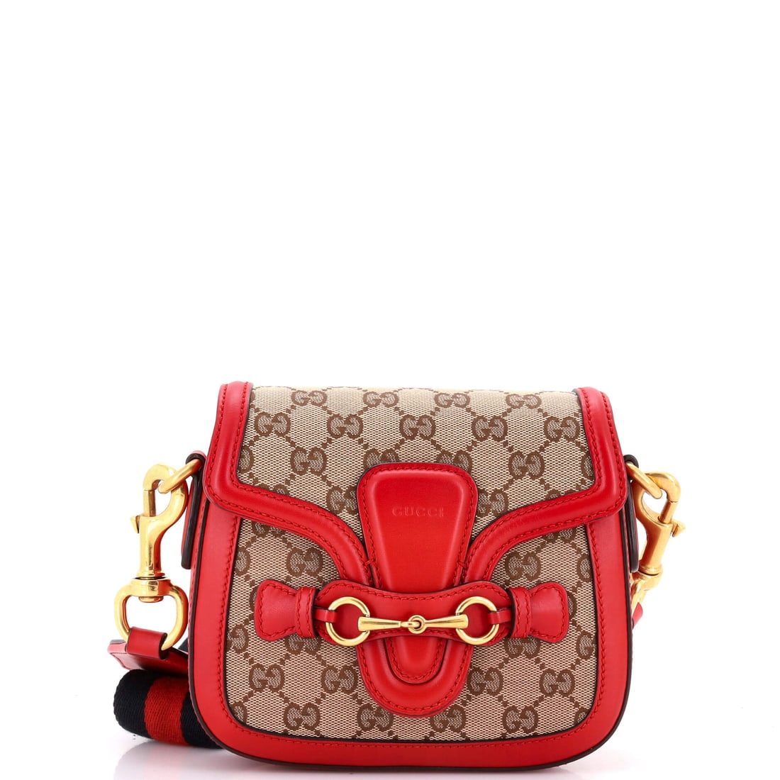 Gucci Lady Web Shoulder Bag GG Canvas Small: Lady Web Shoulder Bag in gg canvas sits squarely within the Gucci canon, the structural language unmistakable on sight. The brown, red colorway sits richly across the surface, holding the surface lumi