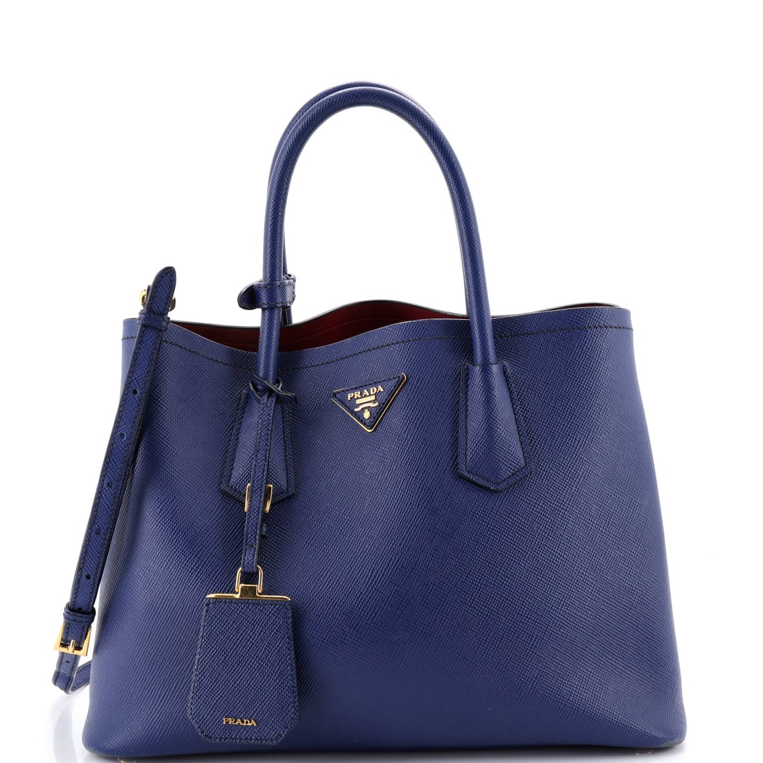Prada Cuir Double Tote Saffiano Leather Medium: The Prada Cuir Double Tote's slip and zip pockets read like a brief from the editor's desk, organized for the realities of a working day. The blue treatment carries its own presence, drawn in Saffiano