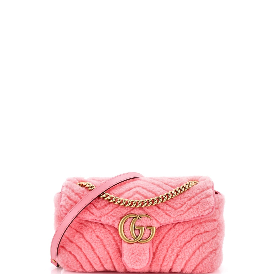 Gucci GG Marmont Flap Bag Matelasse Shearling Small: Open the Gucci GG Marmont Flap Bag and the pocketing is the first thing you notice, the kind of interior that takes structure seriously. Cast in a saturated pink, drawn in matelasse, the quilted, padd