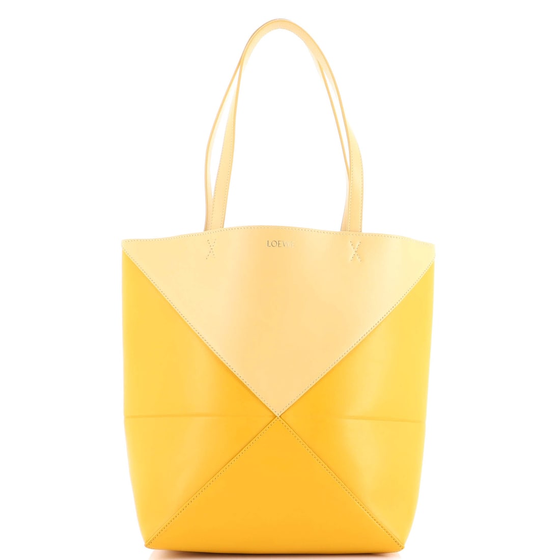Loewe Puzzle Fold Tote Leather Medium: Cut from leather, the Loewe Puzzle Fold Tote reads soft to the touch and disciplined on the body. The yellow treatment carries its own presence, calibrated to read editorial in any light. Measuring ap