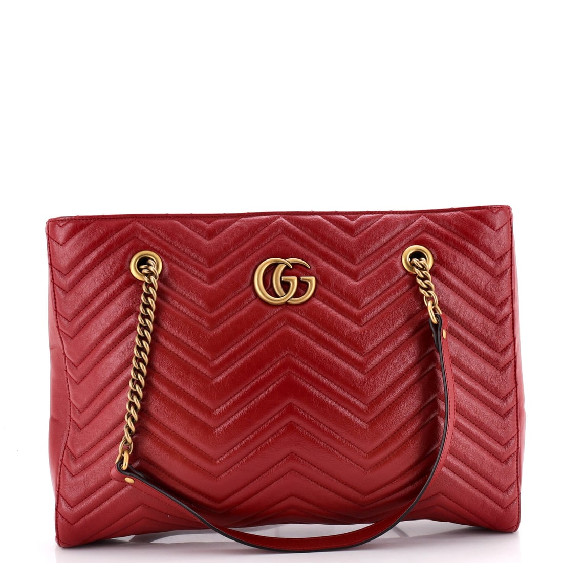 Gucci GG Marmont Zip Tote Matelasse Leather Medium: Sling the Gucci GG Marmont Zip Tote and it falls into the right spot at the hip, the strap sized to the wearer's natural reach. A luminous red palette carries the read, rendered in matelasse, the quil