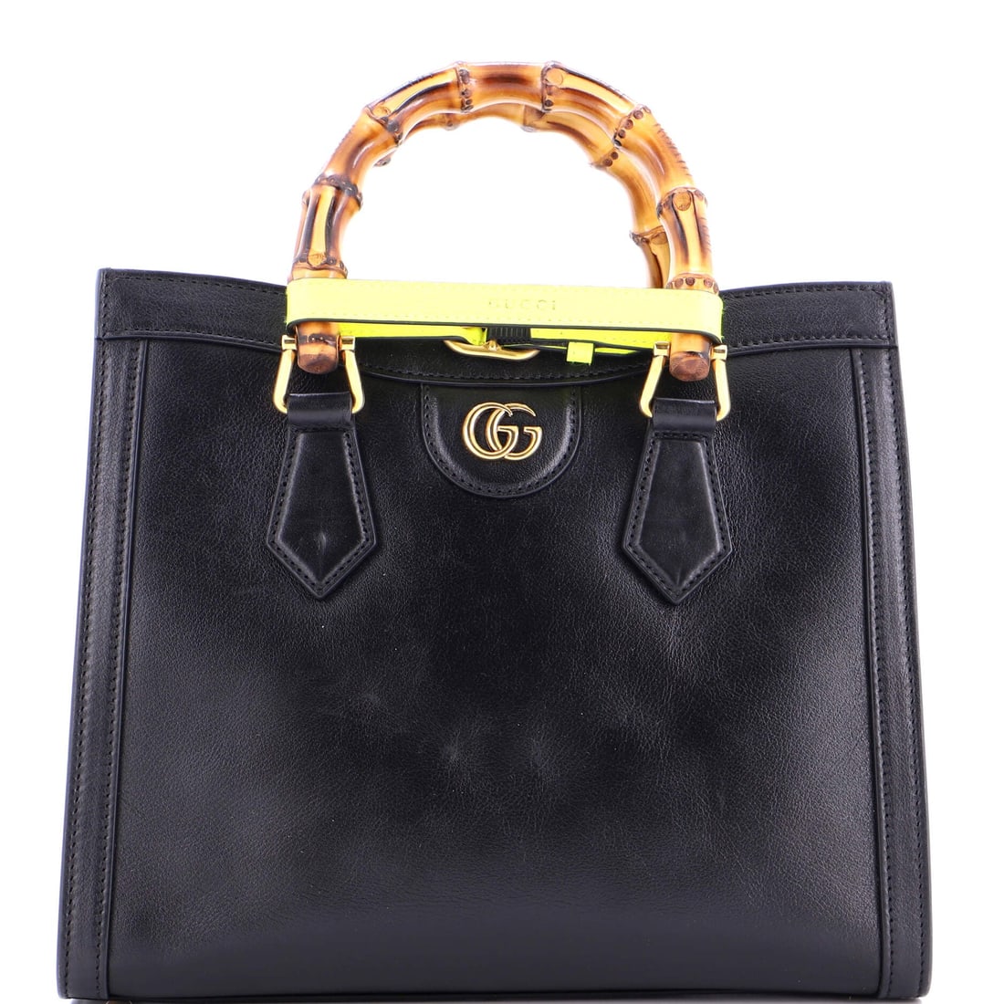 Gucci Diana NM Bamboo Handle Tote Leather Small: This iteration of the Gucci Diana NM Bamboo Handle Tote carries the design vocabulary the house has built over multiple seasons of the line. In black, the silhouette reads modern without effort, sized