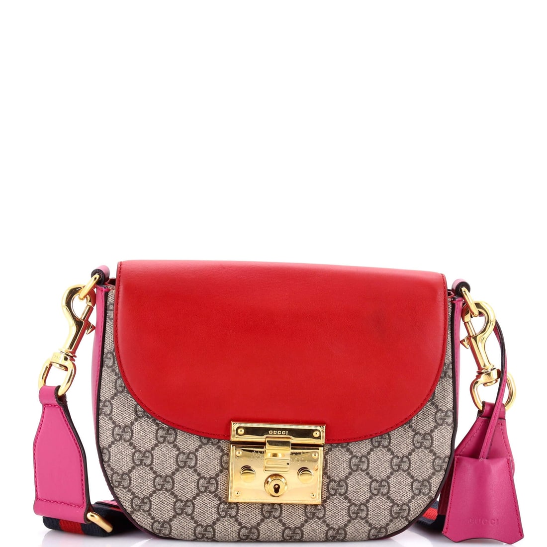 Gucci Padlock Saddle Shoulder Bag GG Coated Canvas and Leather Medium: The Gucci Padlock Saddle Shoulder Bag arrives with its architecture intact, the proportions calibrated to the silhouette buyers already know by heart. In brown, red, the silhouette reads modern withou