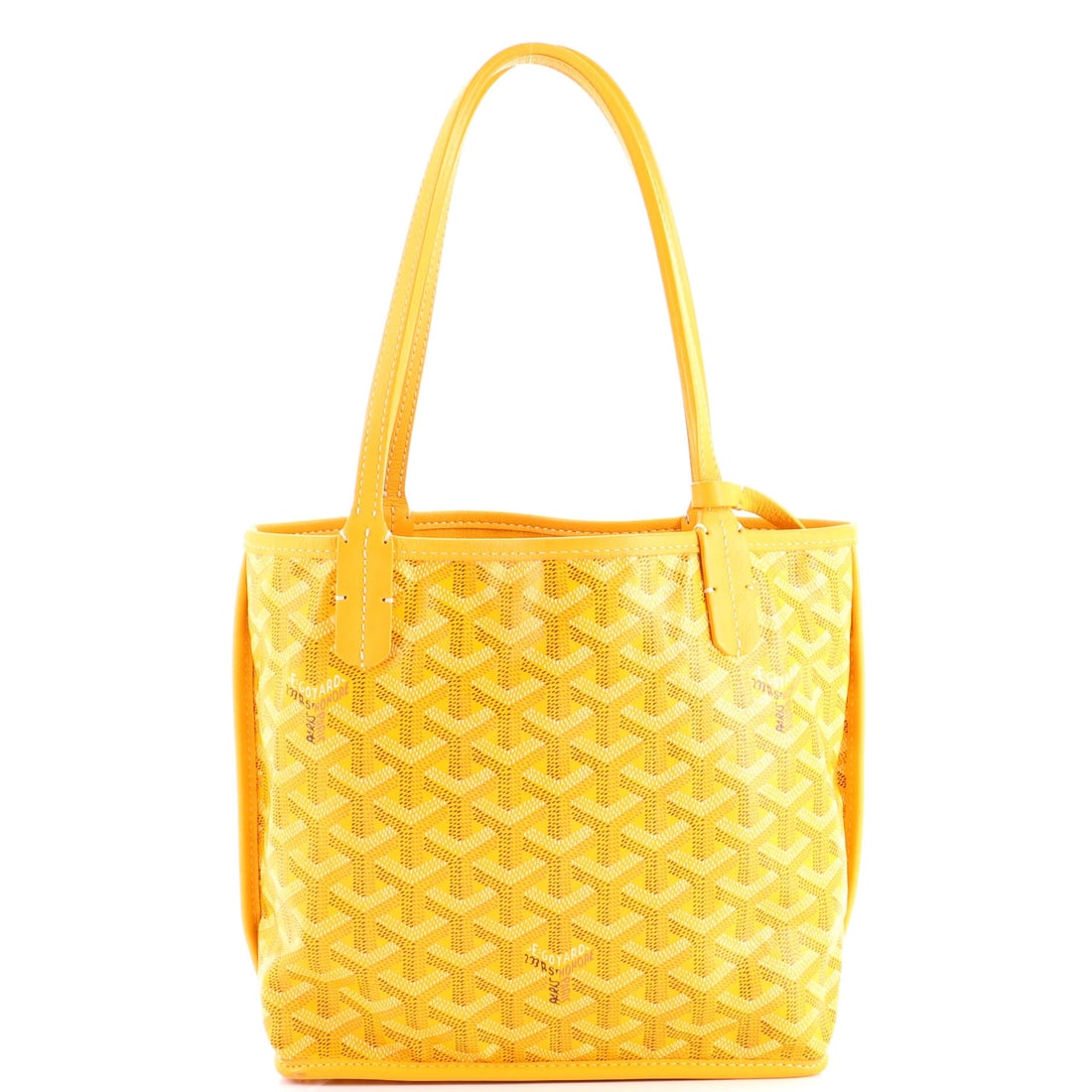 Goyard Anjou Reversible Tote Coated Canvas Mini: The Goyard Anjou Reversible Tote arrives with the kind of exterior architecture that reads at a glance, its silhouette holding its line whether set down or carried. The body reads in the house's coate