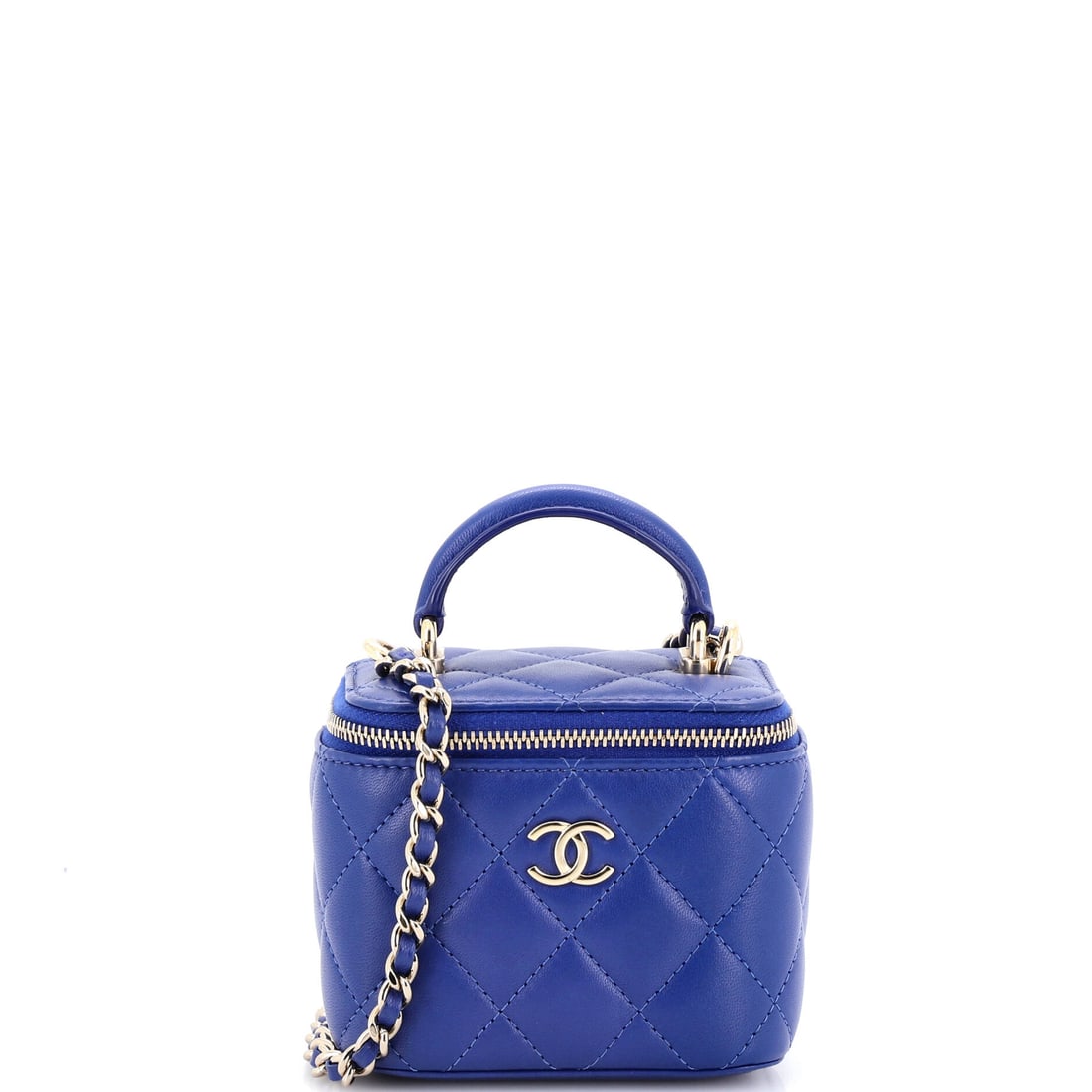 Chanel Classic Top Handle Vanity Case with Chain Quilted Lambskin Mini: The Chanel Classic Top Handle Vanity Case with Chain reads first through its material, quilted lambskin, a soft nappa leather worked in the house's signature diamond stitch, setting the tone before th