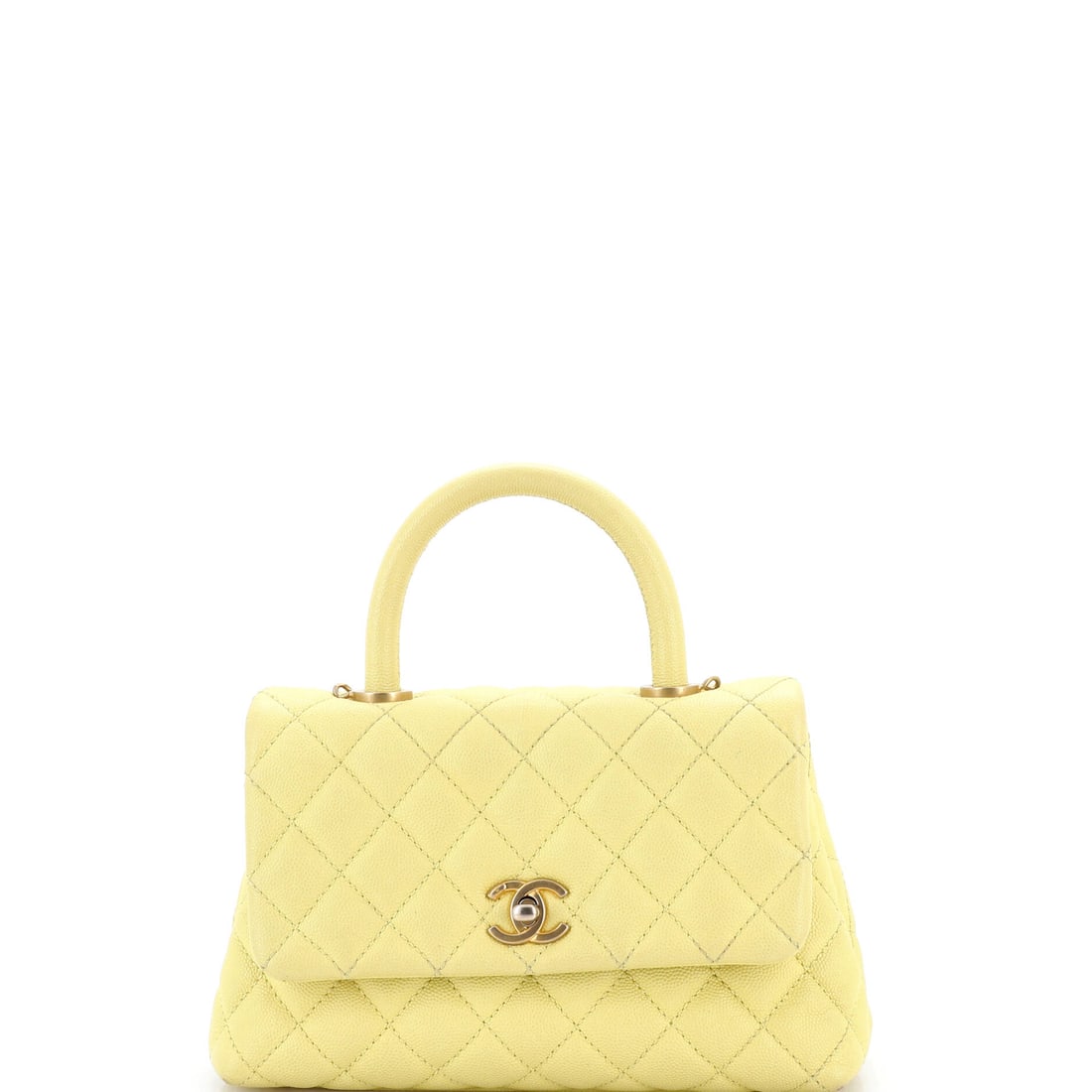 Chanel Coco Top Handle Bag Quilted Caviar Mini: This Chanel Coco Top Handle Bag earns its keep on the shoulder first, the silhouette tuned for the way a luxury handbag is actually worn from morning into evening. The body reads in quilted caviar, Ch