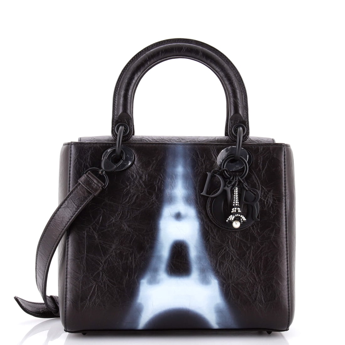 Christian Dior Lady Dior Bag Limited Edition Eiffel Tower Printed Leather Medium: Lift the Christian Dior Lady Dior Bag and it settles into the carry the way the house intended, the strap-to-body ratio reading as deliberate. Built in printed calfskin treated with the house's editor