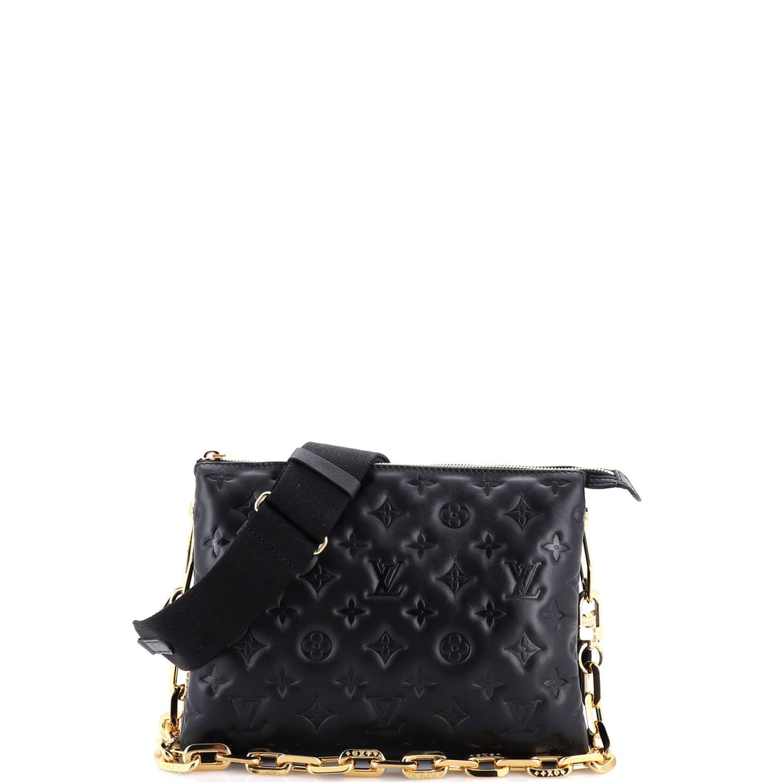 Louis Vuitton Coussin Bag Monogram Embossed Lambskin PM: On the carry, the Louis Vuitton Coussin Bag sits the way a well-considered bag should, balanced rather than pulling, with strap and body in proportion. The body reads in monogram-embossed lambskin, th