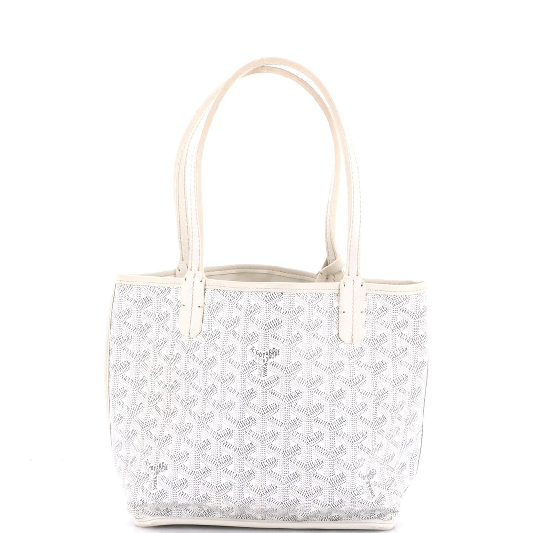 Goyard Anjou Reversible Tote Coated Canvas Mini: Lift the Goyard Anjou Reversible Tote and it settles into the carry the way the house intended, the strap-to-body ratio reading as deliberate. The material story here is the house's coated canvas, a w