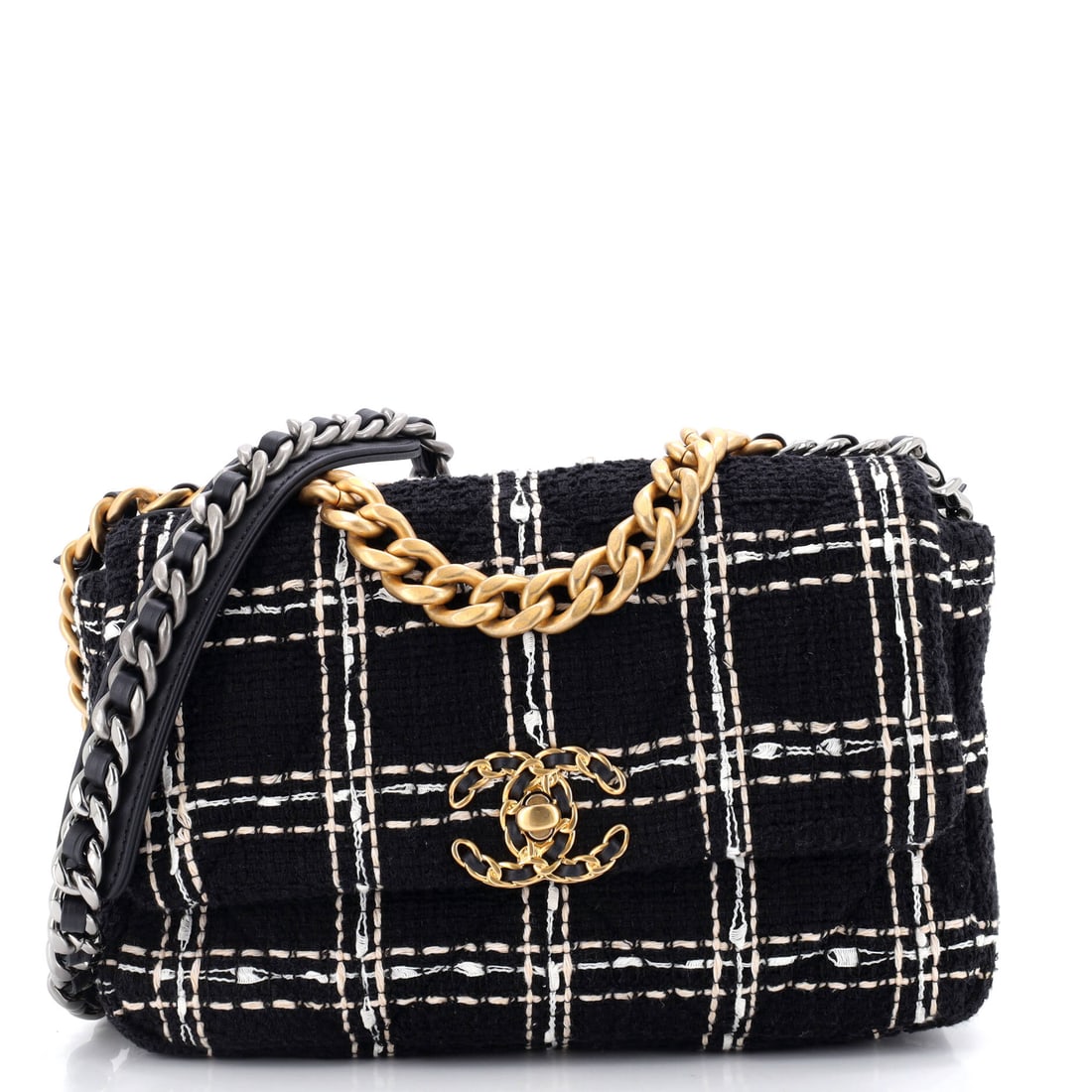 Chanel 19 Flap Bag Quilted Tweed Medium: Sized in Medium, the Chanel 19 Flap Bag occupies the sweet spot of the model family, large enough to carry the essentials and small enough to read polished. Built in quilted tweed, the house's couture
