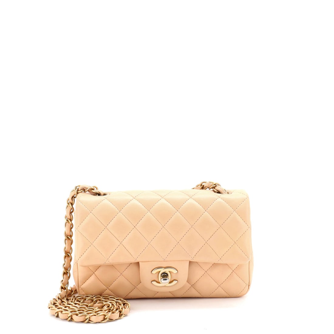 Chanel Classic Single Flap Bag Quilted Lambskin Mini: At the surface, the Chanel Classic Single Flap Bag relies on quilted lambskin, a soft nappa leather worked in the house's signature diamond stitch, the leather choice doing the work of the design.