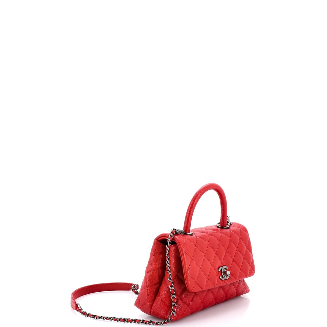 Chanel Coco Top Handle Bag Quilted Caviar Mini: The Chanel Coco Top Handle Bag arrives with the kind of exterior architecture that reads at a glance, its silhouette holding its line whether set down or carried. Built in quilted caviar, Chanel's dia
