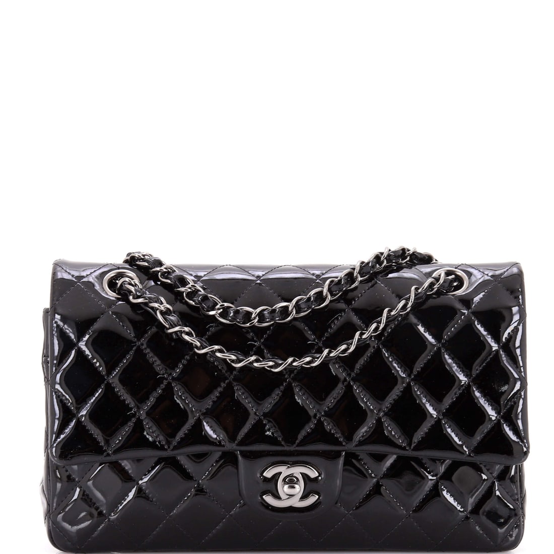 Chanel Classic Double Flap Bag Quilted Patent Medium: Within the maison's longer arc, the Chanel Classic Double Flap Bag is a piece worth catching at this stage of its evolution. Finished in quilted patent, a high-shine lacquered finish over the diamond 