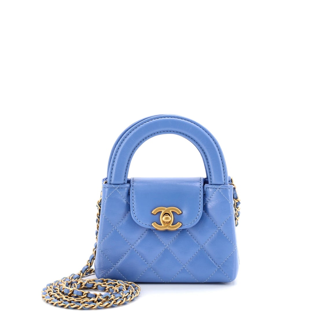 Chanel Kelly Top Handle Shopping Bag Quilted Shiny Aged Calfskin Nano: Issued in the Nano size, the Chanel Kelly Top Handle Shopping Bag sits at a deliberate point in the model family, neither the conversation starter nor the quiet companion but somewhere usefully in bet