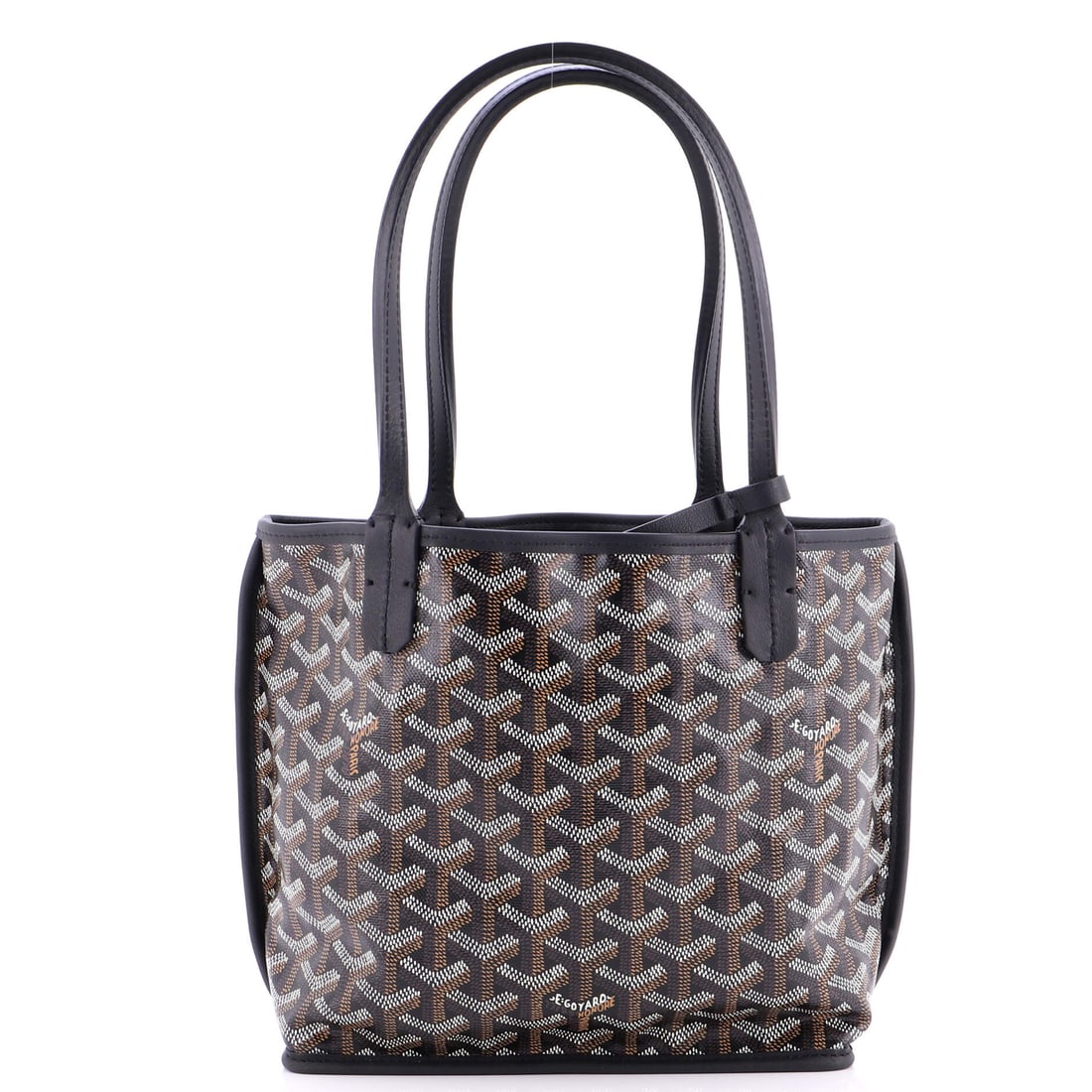 Goyard Anjou Reversible Tote Coated Canvas Mini: Hardware on the Goyard Anjou Reversible Tote sits with the bag rather than on top of it, a small detail that separates considered design from decorative volume. The material story here is the house's 
