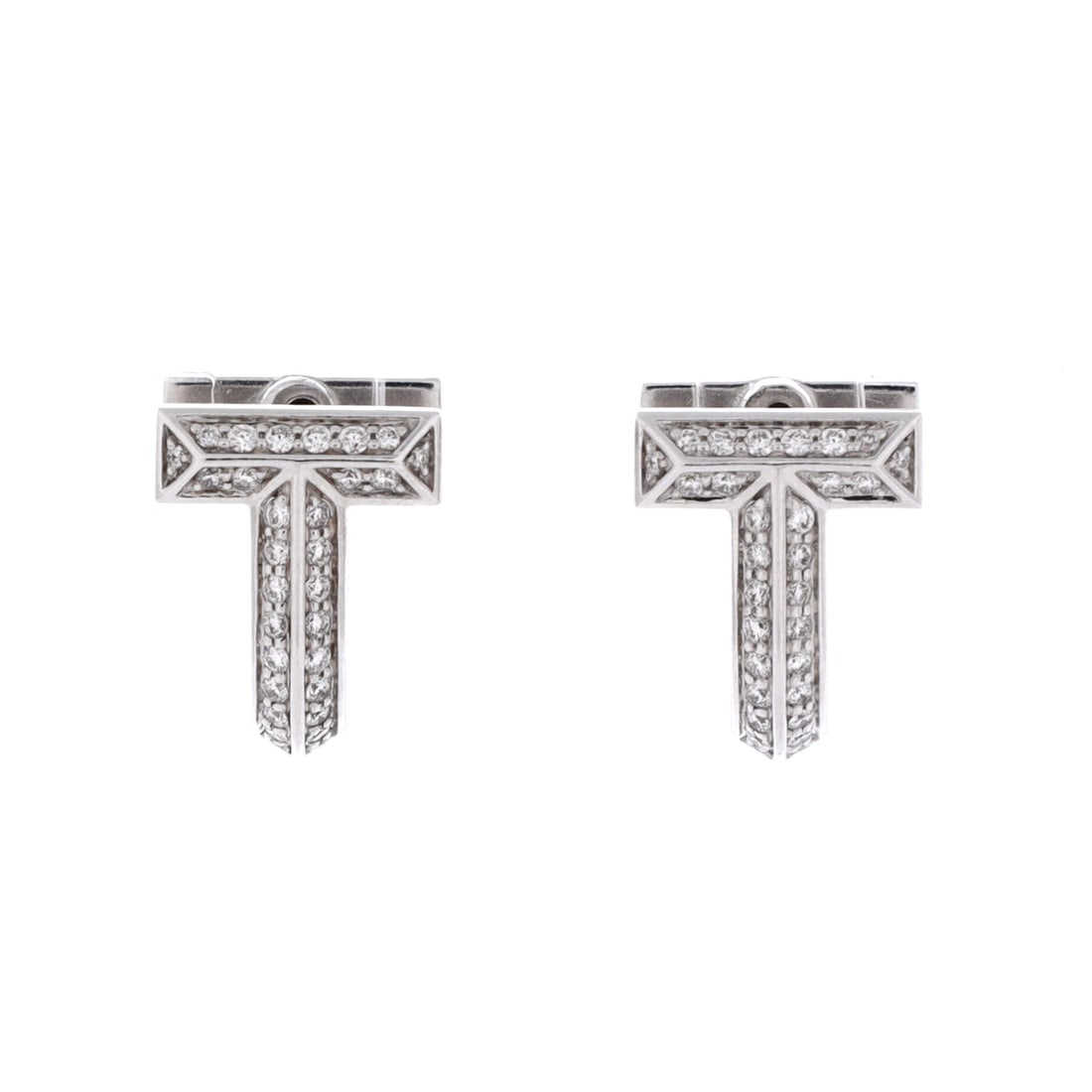 Tiffany & Co. T1 Huggie Hoop Earrings 18K White Gold with Half Pave Diamonds White Gold: A Tiffany & Co. T1 Huggie Hoop Earrings, worked in 18K White Gold and set with diamonds and pavé diamonds. The diamonds and pavé diamonds add a measure of brightness and lift the piece's presence