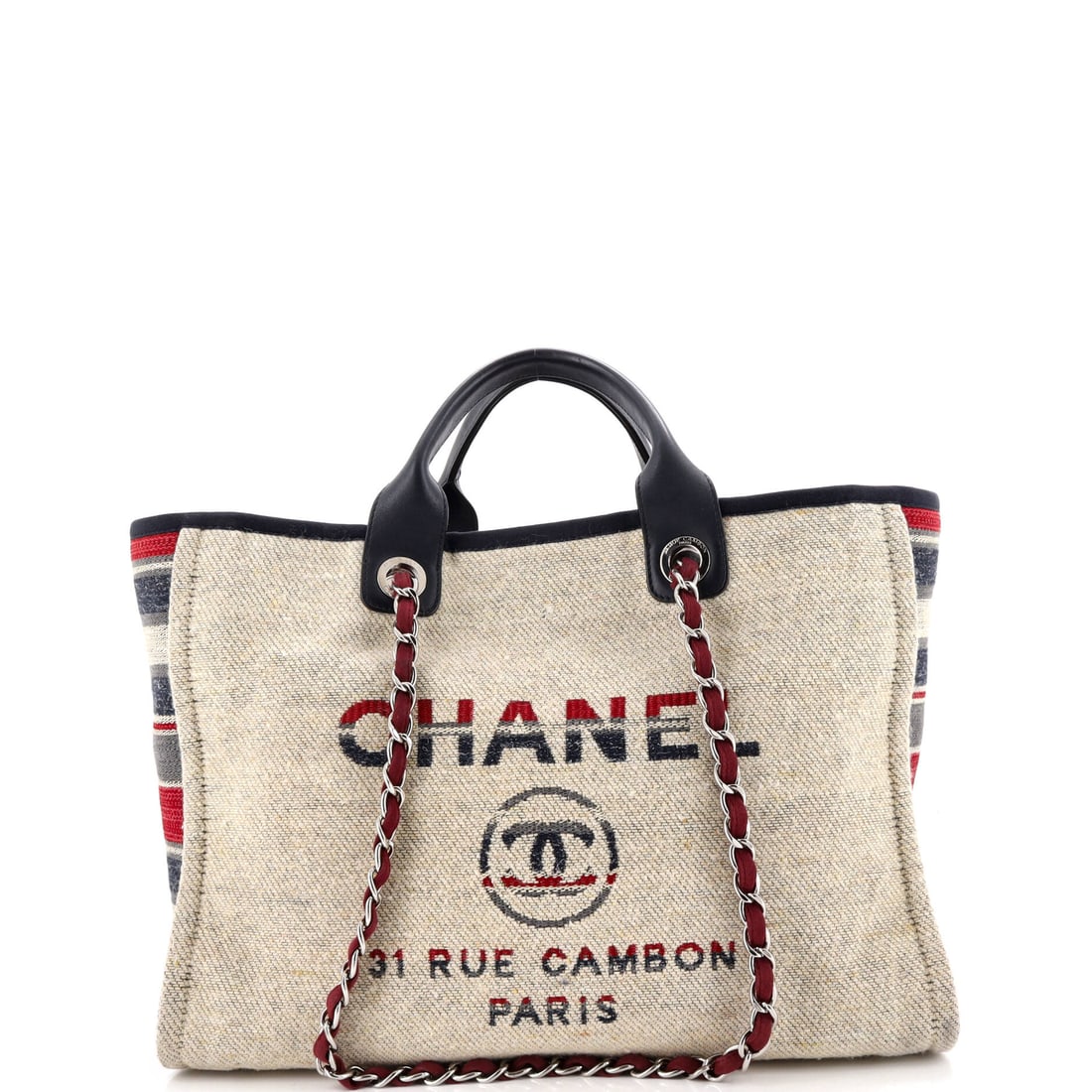 Chanel Deauville Tote Canvas Medium Multicolor, Neutral: The Chanel Deauville Tote in multicolor and neutral coated canvas. This is the Medium format. It measures approximately 11 x 15 x 7 inches. The recognizable profile carries immediate brand recognition