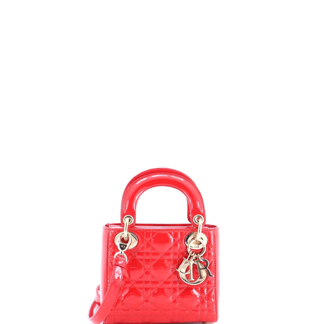 Christian Dior Lady Dior Bag Cannage Quilt Patent Mini Red: A Christian Dior Lady Dior Bag Cannage Quilt in red patent. This is the Mini format. Scale runs to about 6 x 7 x 3 inches. Structured enough to anchor a wardrobe yet versatile across daily wear, it ho