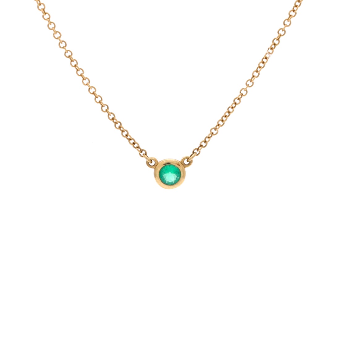 Tiffany & Co. Elsa Peretti Color By The Yard Pendant Necklace 18K Yellow Gold with Emerald .07CT Yel: From Tiffany & Co., the Elsa Peretti Color By The Yard Pendant Necklace with.07CT Yel in 18K Yellow Gold and set with emerald. The emerald add a measure of brightness and lift the piece's presence on 