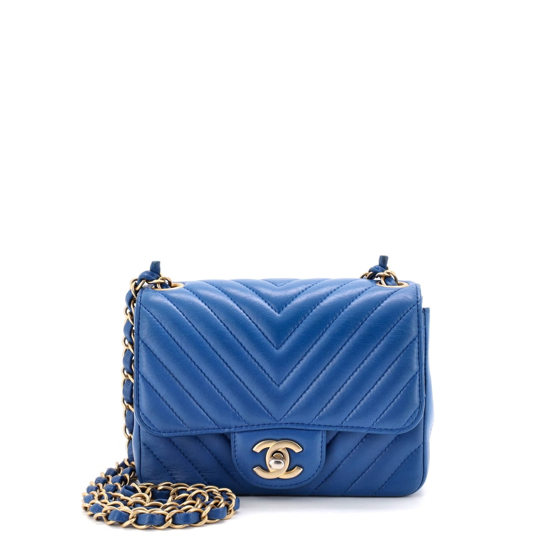 Chanel Square Classic Single Flap Bag Chevron Lambskin Mini Blue: Chanel's Square Classic Single Flap Bag Chevron in blue lambskin leather. Lambskin gives the piece a soft, supple hand characteristic of the house's quilting. Offered in the Mini size. The piece measu