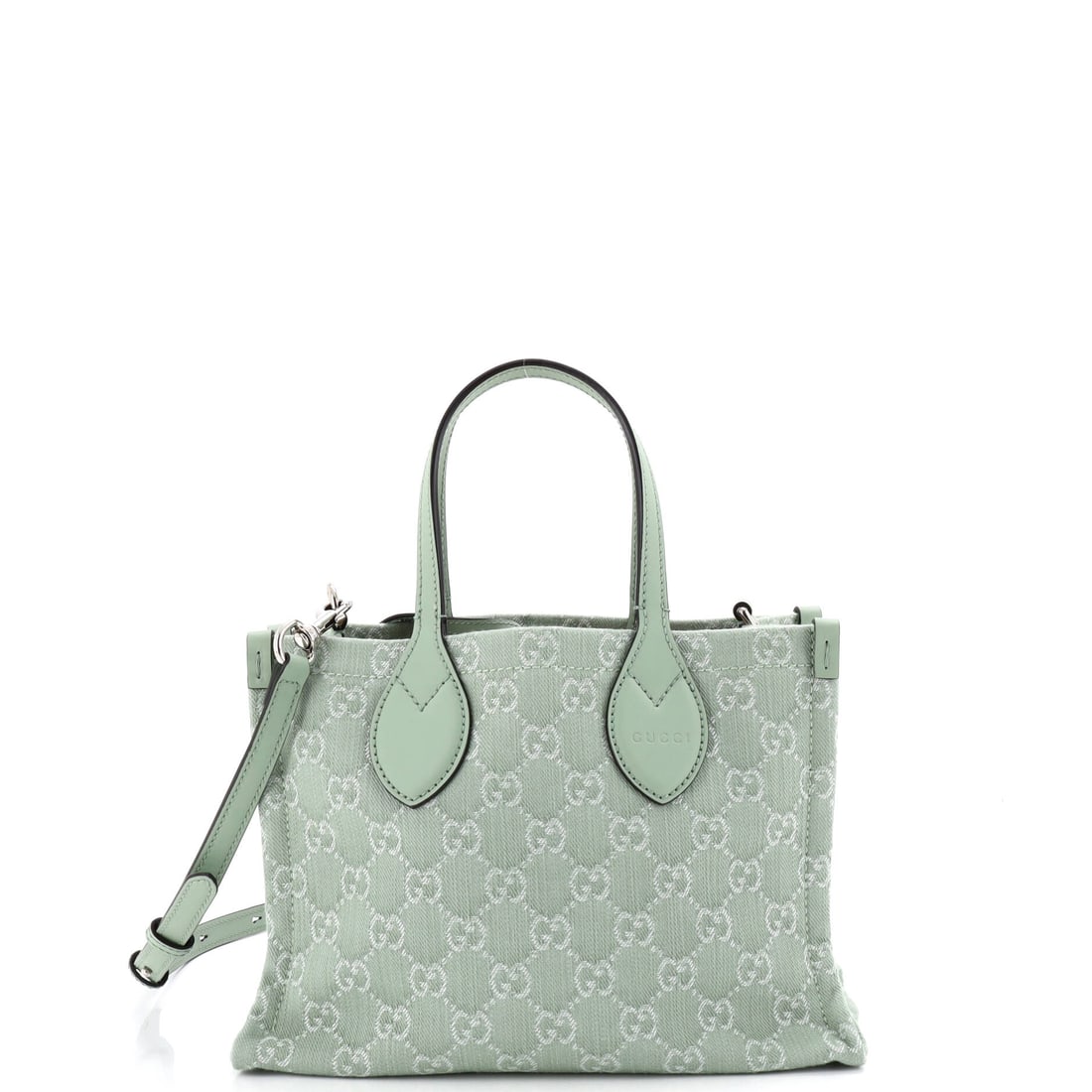 Gucci Ophidia Shopper Tote GG Denim Medium Green: A Gucci Ophidia Shopper Tote GG in green denim. The denim treatment gives the piece a casual, contemporary edge. It is presented in the Medium size. The piece measures roughly 7.5 x 11 x 4 inches. Its