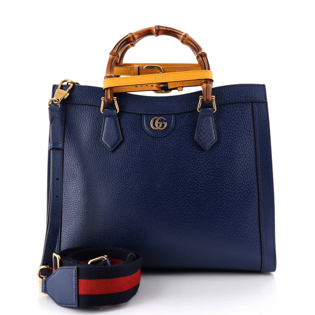 Gucci Diana NM Bamboo Handle Tote Leather Medium Blue: Gucci Diana Bamboo Handle Tote in blue leather. Offered in the NM size. The piece measures roughly 11.5 x 14 x 5.5 inches. The shape and scale give bidders a confident read on how the piece carries an