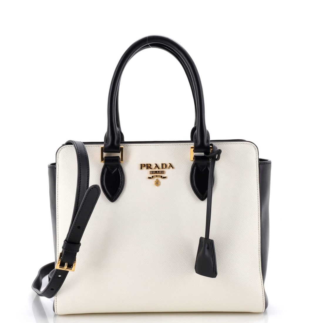 Prada Convertible Open Tote Saffiano Leather Small White: The Prada Convertible Open Tote in white Saffiano leather. It is presented in the Small size. Approximate dimensions are 9 x 10 x 4 inches. A practical scale paired with a familiar house line makes th