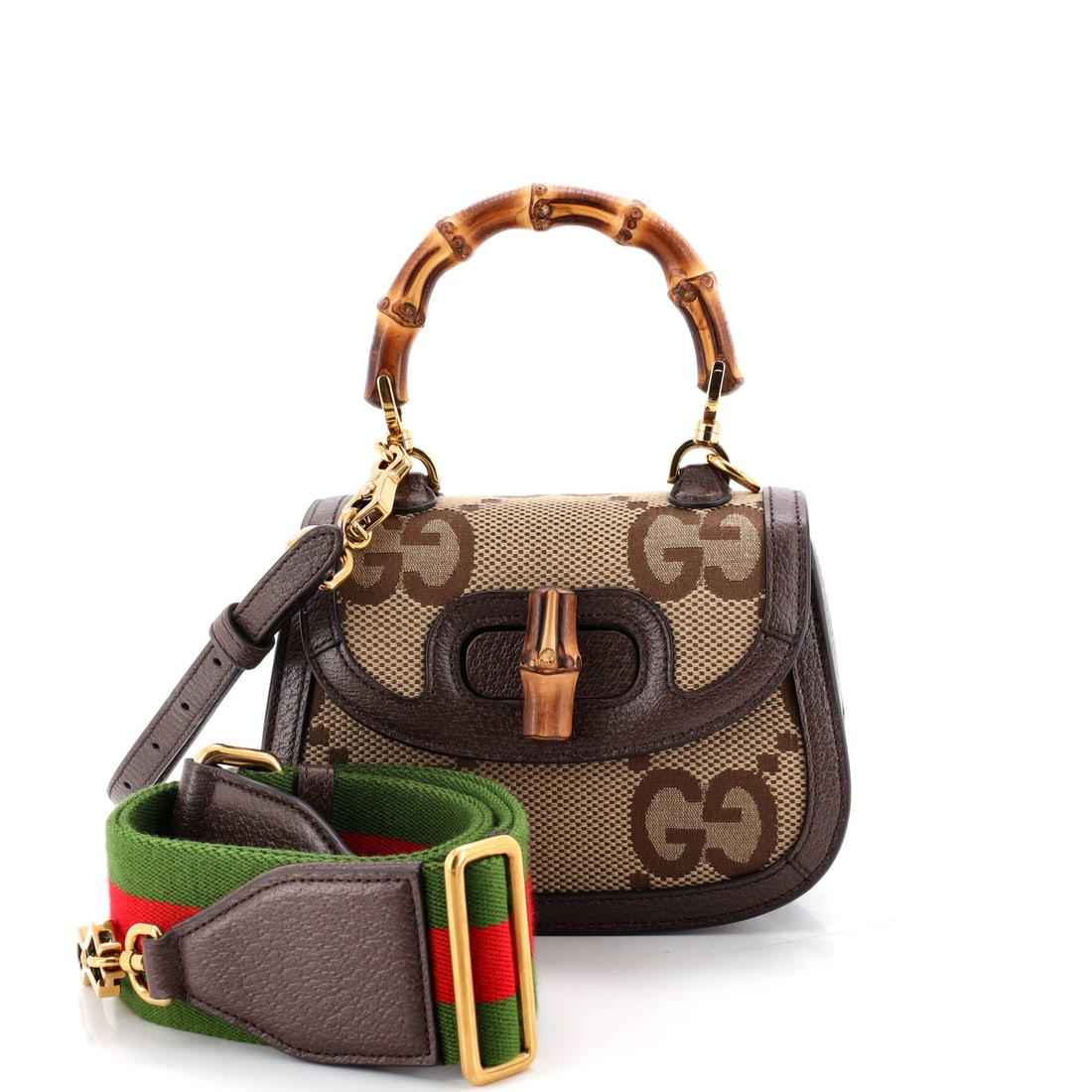 Gucci Bamboo 1947 Top Handle Bag Jumbo GG Canvas Mini Brown: Gucci Bamboo 1947 Top Handle Bag GG in brown coated canvas. Offered in the Jumbo size. Approximate dimensions are 5 x 6.5 x 3 inches. A wearable, well-recognized design that translates easily from dai