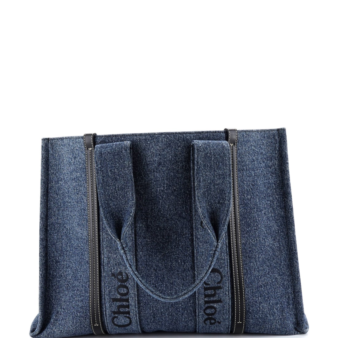 Chloe Woody Tote Canvas with Leather Large Blue: From Chloe, the Woody Tote in blue coated canvas. Offered in the Large size. Approximate dimensions are 12.5 x 17 x 5 inches. A practical scale paired with a familiar house line makes this a strong ev